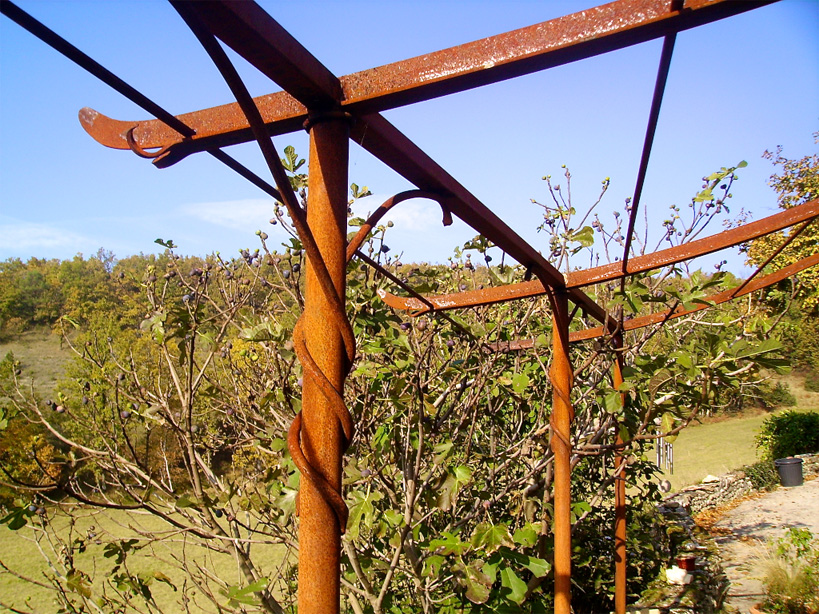 A naturally rusted terrace canopy prior to varnishing
